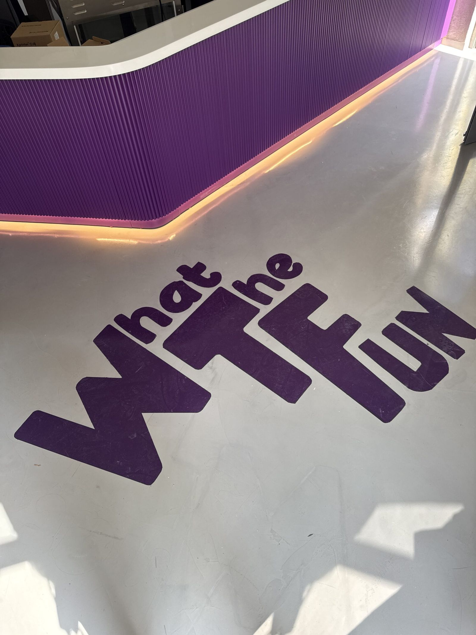 WTFun entrance — the giant floor lettering at reception